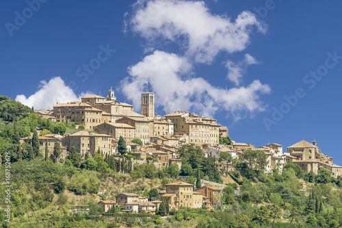 Stunning view of the Tuscan hilltop village of Montepulciano  Siena  Italy  on a sunny day with some white clouds