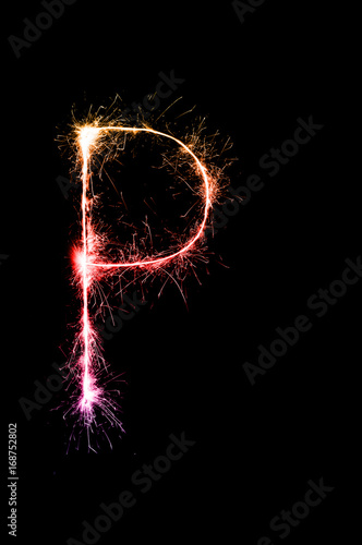 English alphabet from sparkler on black background,Alphabet big letter