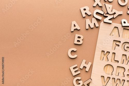 Foto Wooden board with English alphabet letters