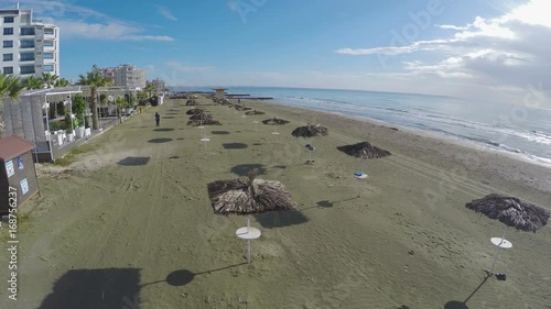 Wallpaper Mural Low season in Larnaca city, aerial shot above beach with straw parasols Torontodigital.ca