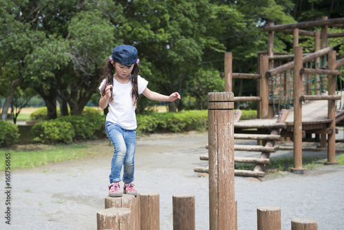 Little girl playing in the park © hakase420