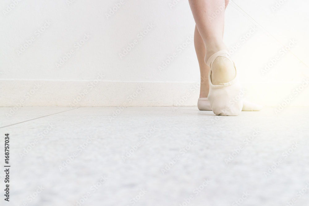 ballet point foot position on right frame on the street with point shoes, light effect ballet point foot position on right frame on the street with point shoes, light effect