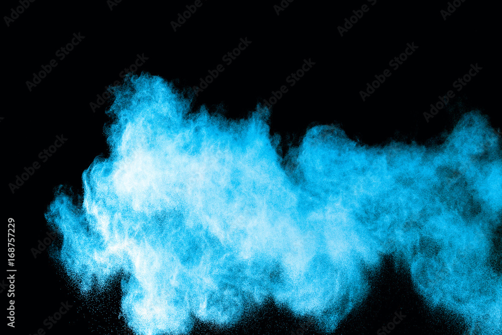 Fototapeta premium Abstract blue powder splatted on white background. Freeze motion of blue powder exploding on blackbackgrund.