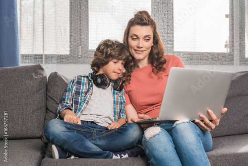 family with laptop at home