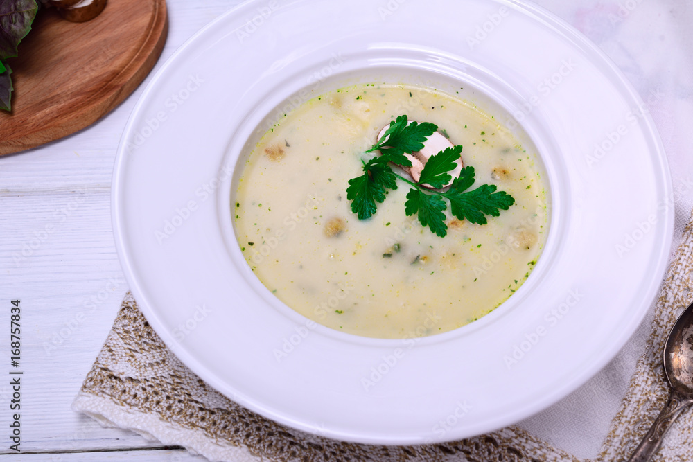 mushroom soup in a white round plate mushroom soup in a white round plate