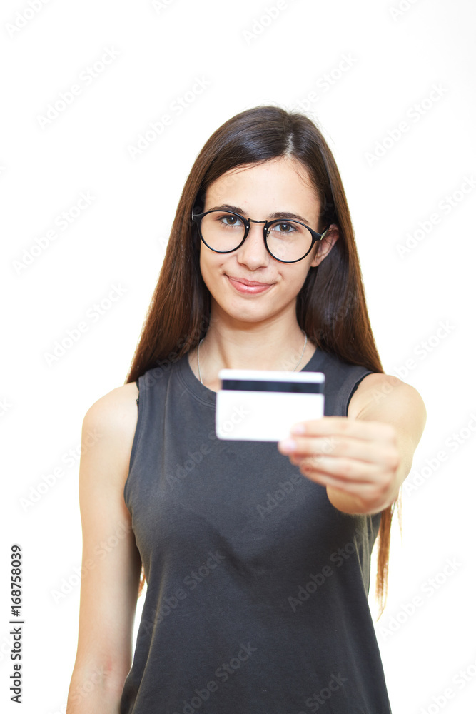 Portrait of happy smiling young business woman in glasses isolated over white background holds credit card Portrait of happy smiling young business woman in glasses isolated over white background holds credit card