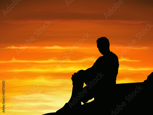 Silhouette lonely man sitting alone when twilight.