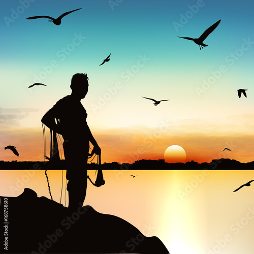 Silhouette of man wainting to catch the fish in twilight. photo