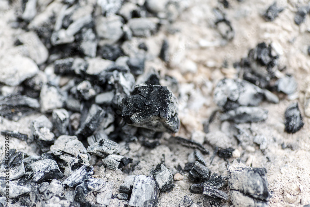 Many burned embers, abstract background, selective focus Many burned embers, abstract background, selective focus