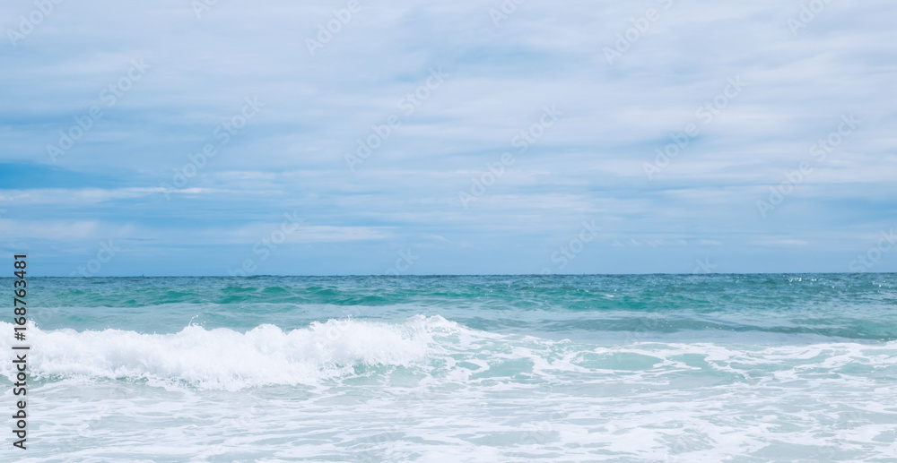 wave in the ocean with blue sky background