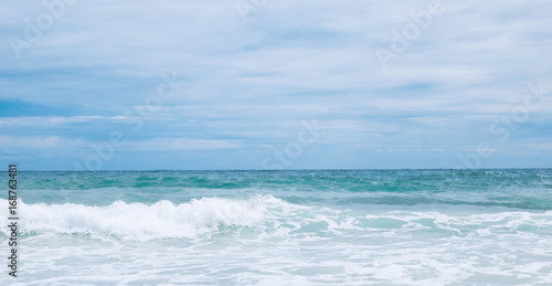 wave in the ocean with blue sky background