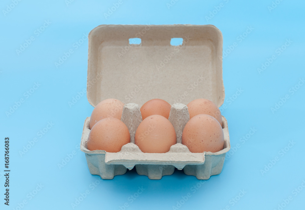 paper egg tray box on blue background