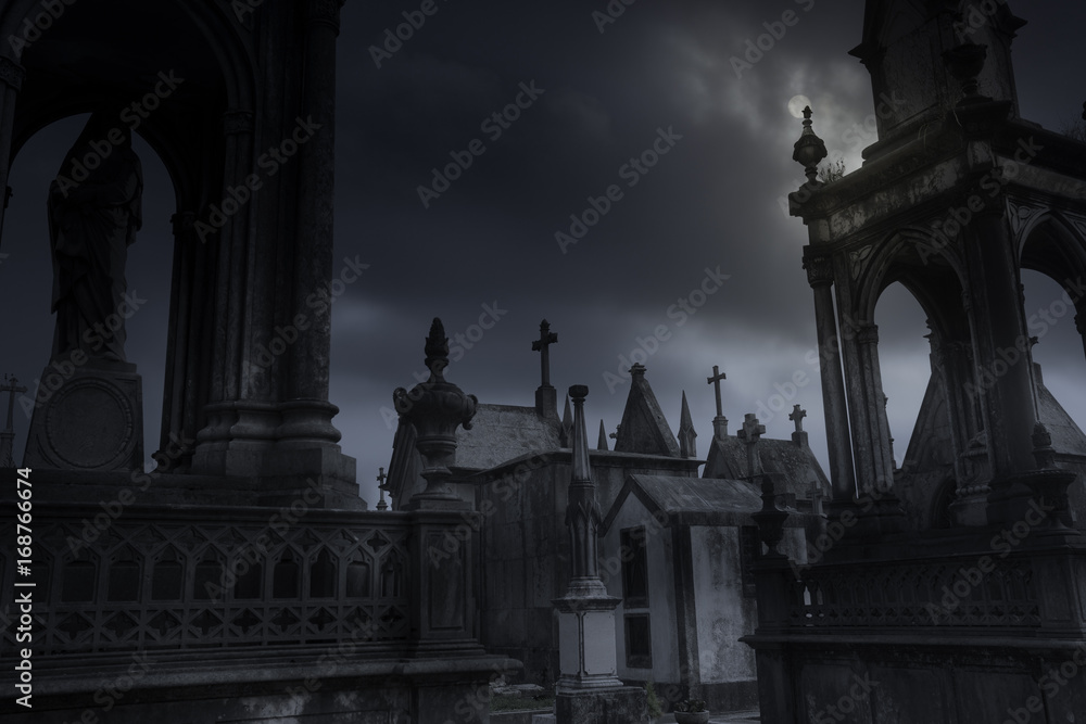 Fototapeta premium cemetery in an overcast full moon night