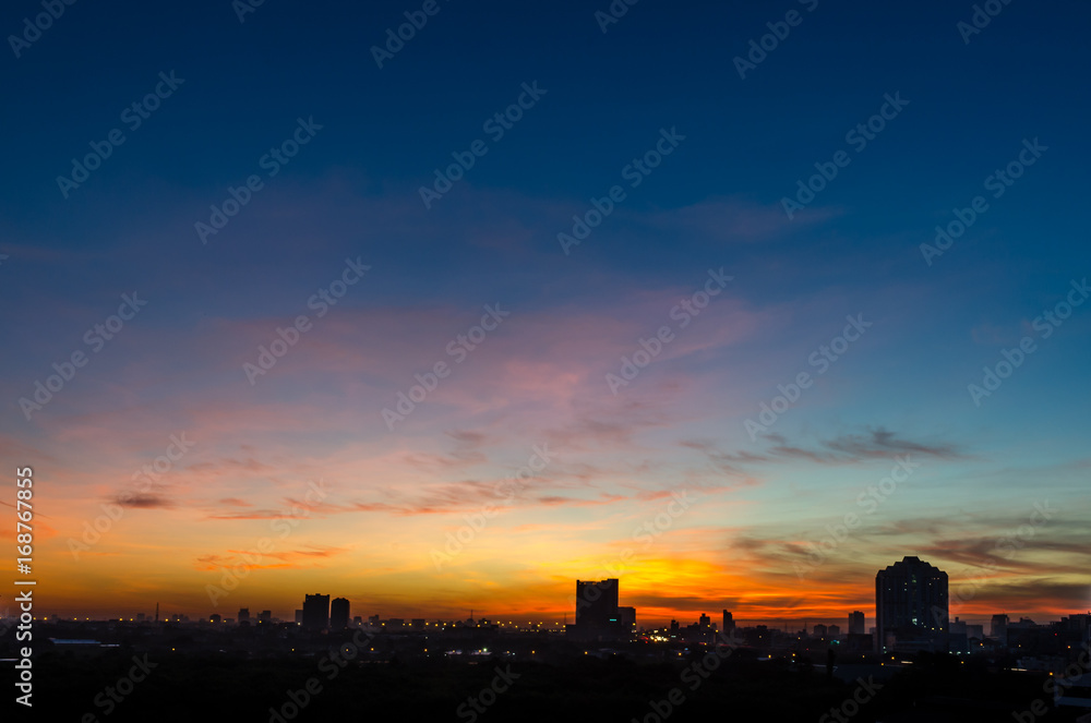 Amazing sunset skyscape with silhouette city town with copy space, Bangkok, Thailand