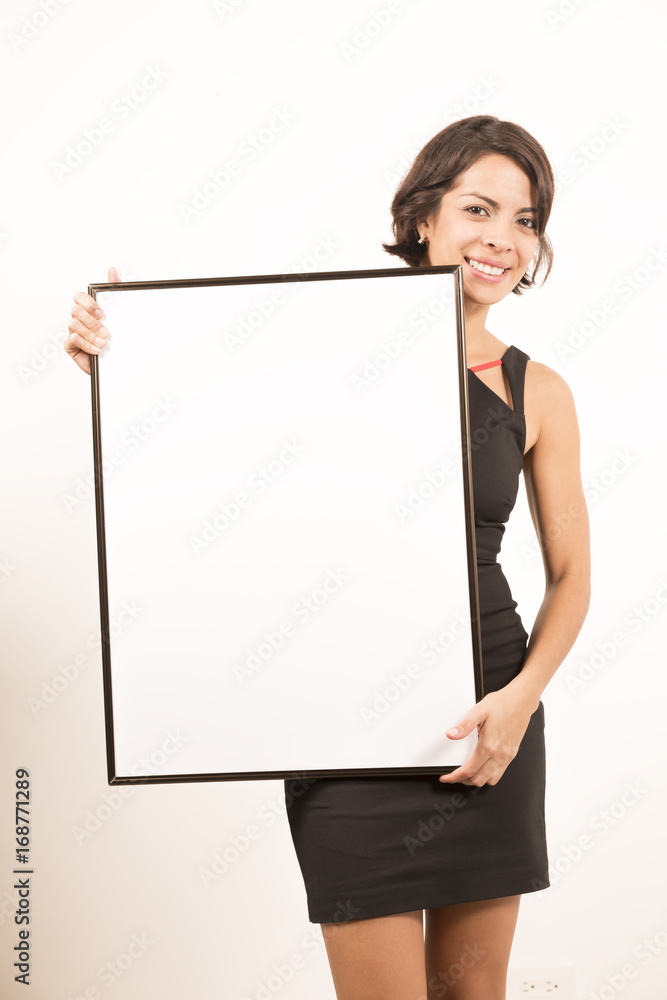 Beautiful young woman holding a blank sheet of paper Beautiful young woman holding a blank sheet of paper