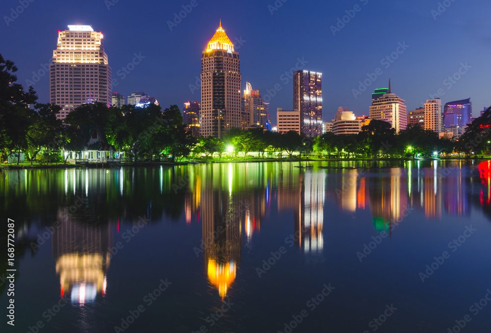 night cityscape in the park from Thailand. Lumpinee park is the landmark nearby Silom in Bangkok. night cityscape in the park from Thailand. Lumpinee park is the landmark nearby Silom in Bangkok.