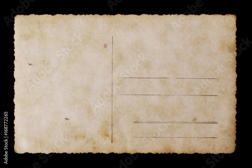 Old blank postcard isolated on black background