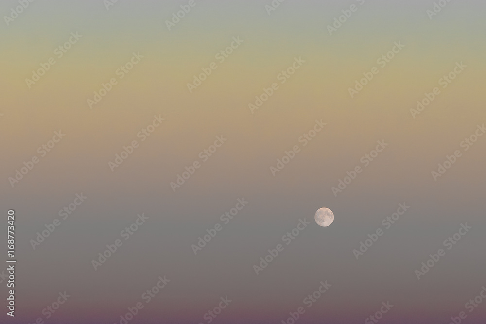 Rise of the full moon in the evening sky. Rise of the full moon in the evening sky.
