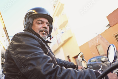 Senior man on sidecar bike