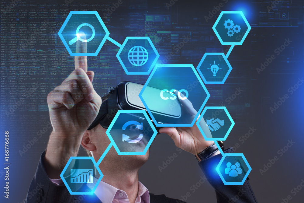 Business, Technology, Internet and network concept. Young businessman working on a virtual screen of the future and sees the inscription: CSO Business, Technology, Internet and network concept. Young businessman working on a virtual screen of the future and sees the inscription: CSO