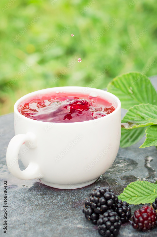 Cup of tea and blackberry Cup of tea and blackberry