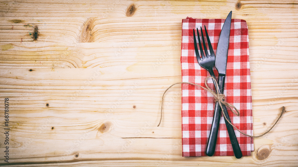 Table setting on wooden background Table setting on wooden background