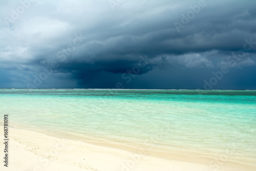 Cloudy landscape of Indian ocean sandy beach before the storm