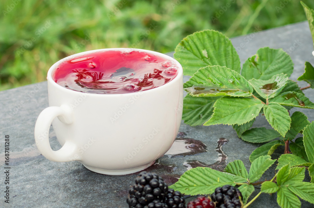 Cup of tea and blackberry Cup of tea and blackberry