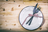 Table setting on wooden background