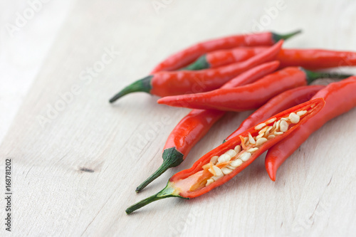 Wallpaper Mural Fresh chilies on wooden background