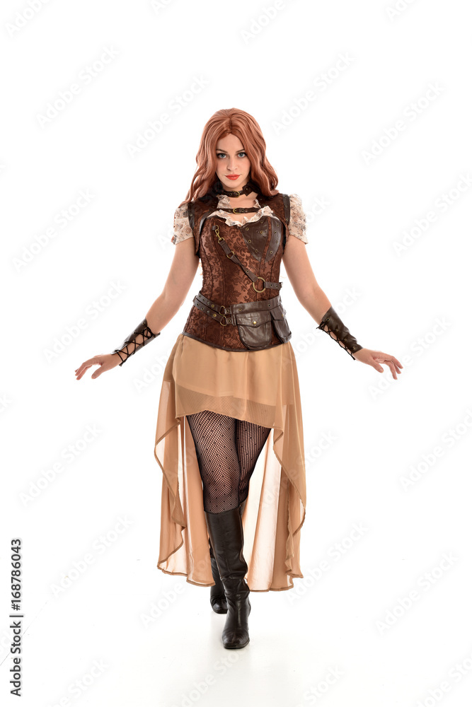 full length portrait of a red haired lady wearing steampunk inspired outfit, standing pose against a white background. full length portrait of a red haired lady wearing steampunk inspired outfit, standing pose against a white background.