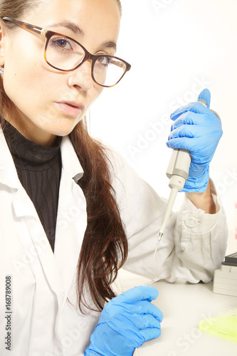 Criminologist lab technician preparing samples for PCR analysis reaction