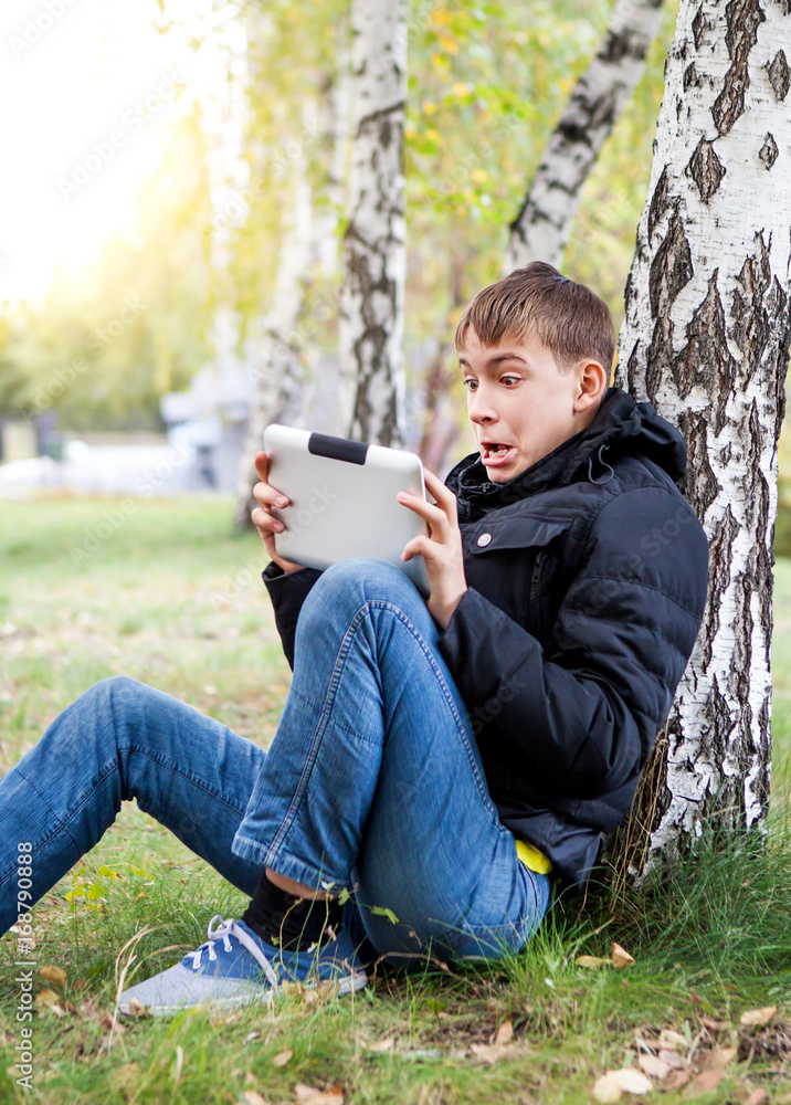 Surprised Teenager with Tablet Surprised Teenager with Tablet