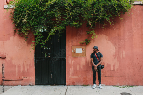 A man standing on the sidewalk in the French Quarter, New Orleans