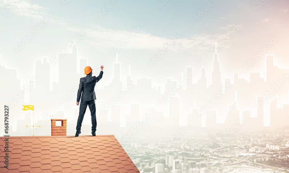 Man architect draw silhouette of modern city on blue sky. Mixed Man architect draw silhouette of modern city on blue sky. Mixed