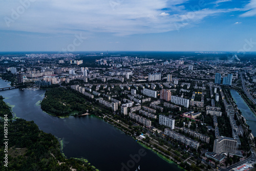 Panoramic view of the city of Kiev with the Dnieper River on the left bank. Aerial view of the residential district of Rusanivka and the metro station Levoberezhnaya