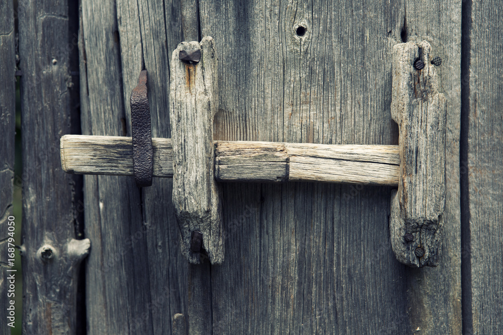 old wooden fence with door handle old wooden fence with door handle