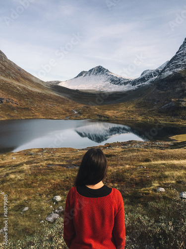 Woman looking at Alnesvatnet Lake, Trollstigen, Norway photo