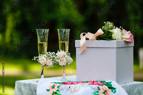 wedding glasses and wedding decor with flowerds photo