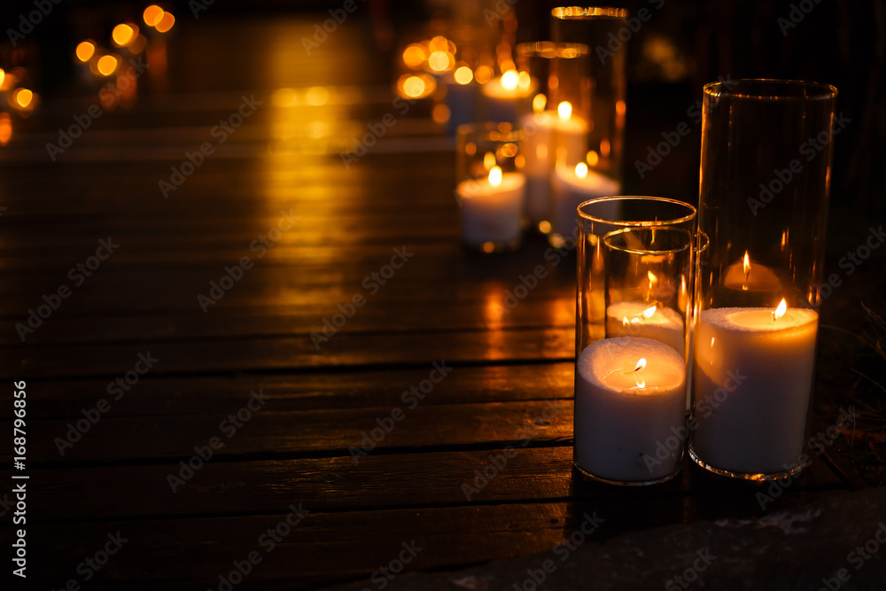 the steps are decorated with glass candlesticks. the steps are decorated with glass candlesticks.