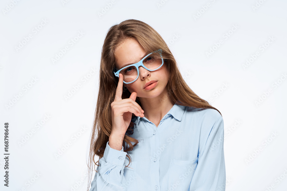 Beautiful young woman in glasses on white isolated background, portrait