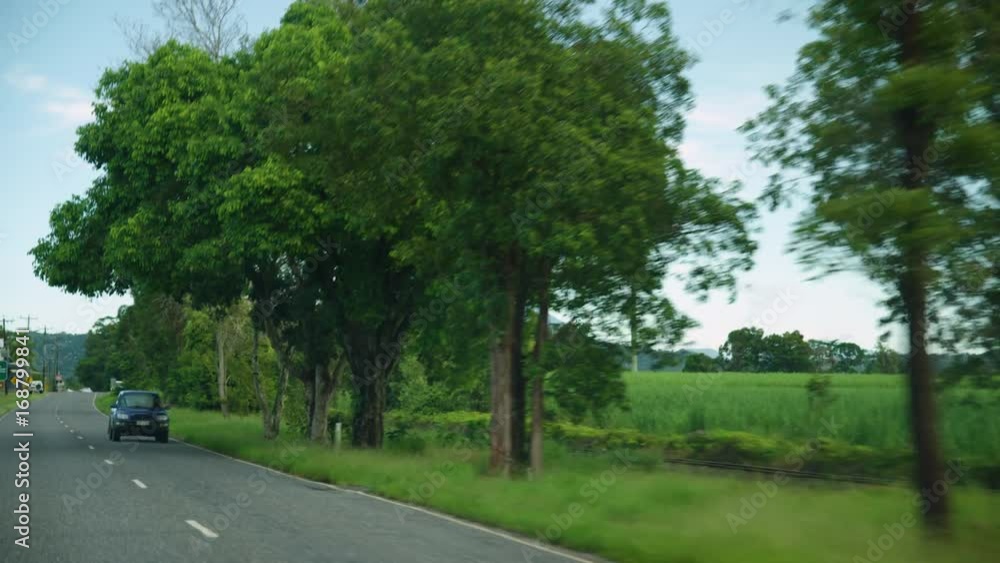 A panning shot to the left. Highway shot with cars passing by. A panning shot to the left. Highway shot with cars passing by.