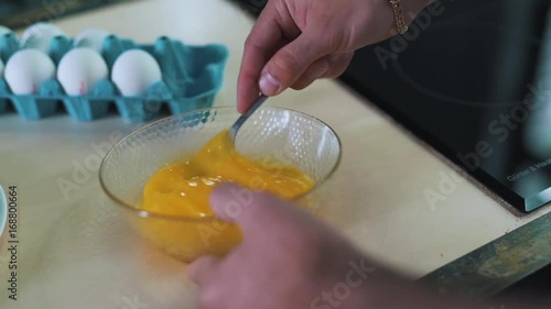 The man is doing omelette. photo