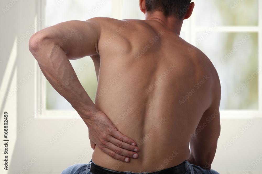 Obraz premium Sport injury, Man with back pain. Pain relief and health care concept.