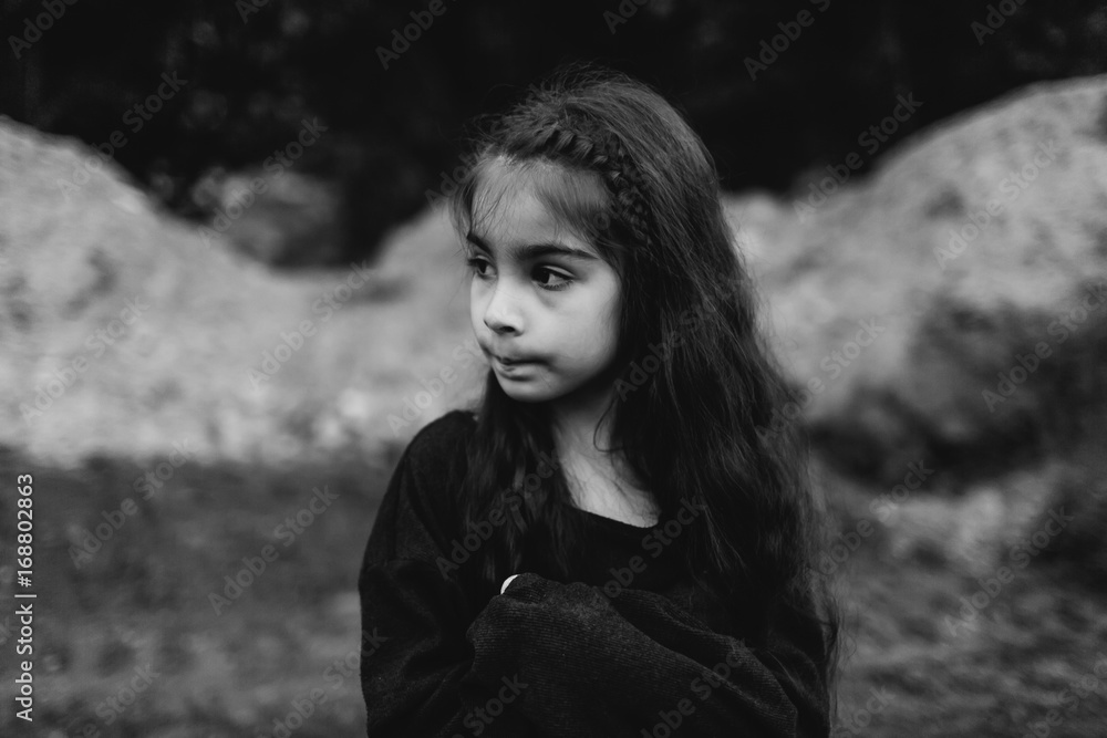Thoughtful little girl in a black sweater Thoughtful little girl in a black sweater