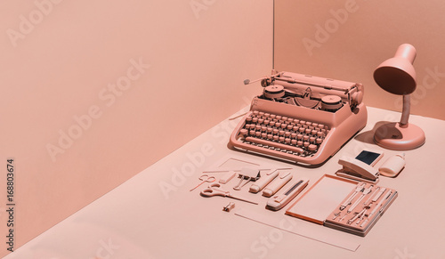 Pink typewriter and office supply photo