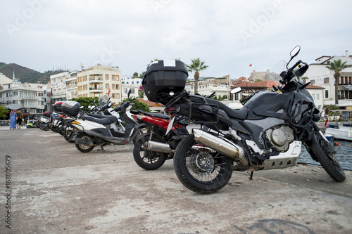 A number of motorcycle parked in rows