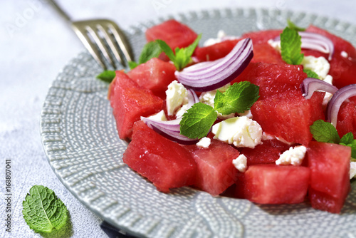 Watermelon salad with feta and red onion.