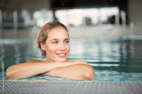 Portrait of beautiful woman relaxing in swimming pool © NDABCREATIVITY