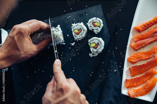 Fotografie Sushi Being Cut
